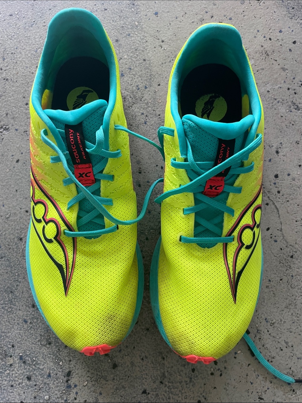 Saucony Neon Yellow and Teal Racing Shoes with Pink Accents